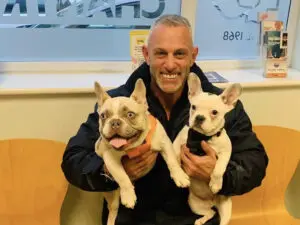 taxi that takes dogs, pet taxi driver with 2 dogs at the vets