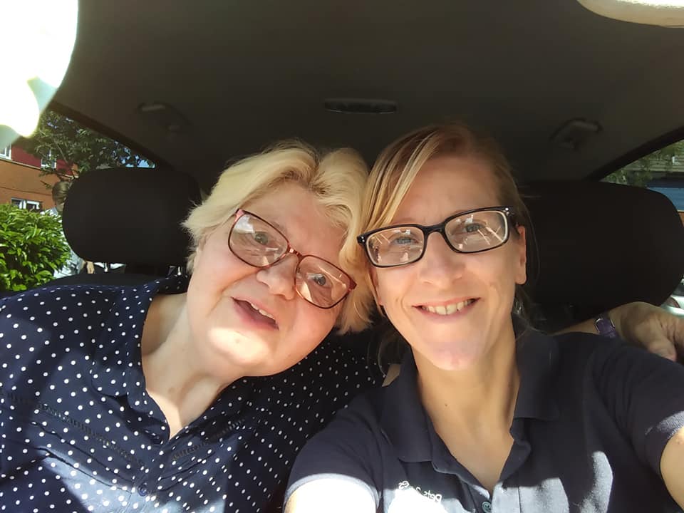 pet taxi driver with customer sat in pet taxi together for selfie