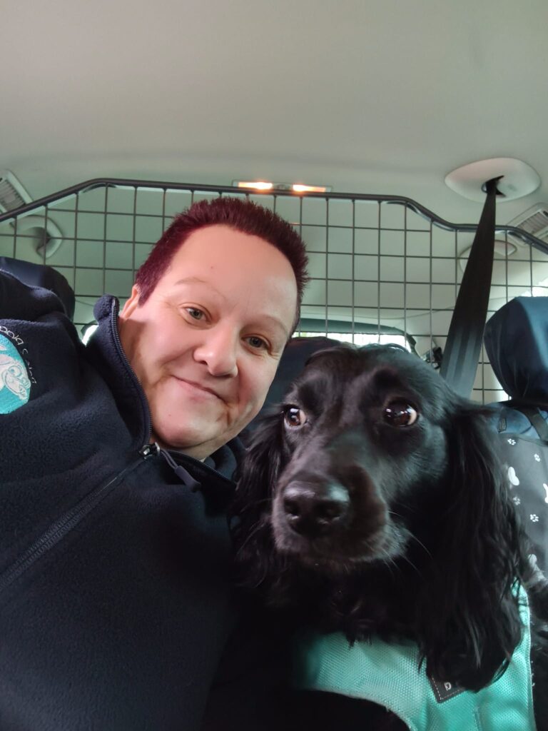Sarah with dog in pet taxi