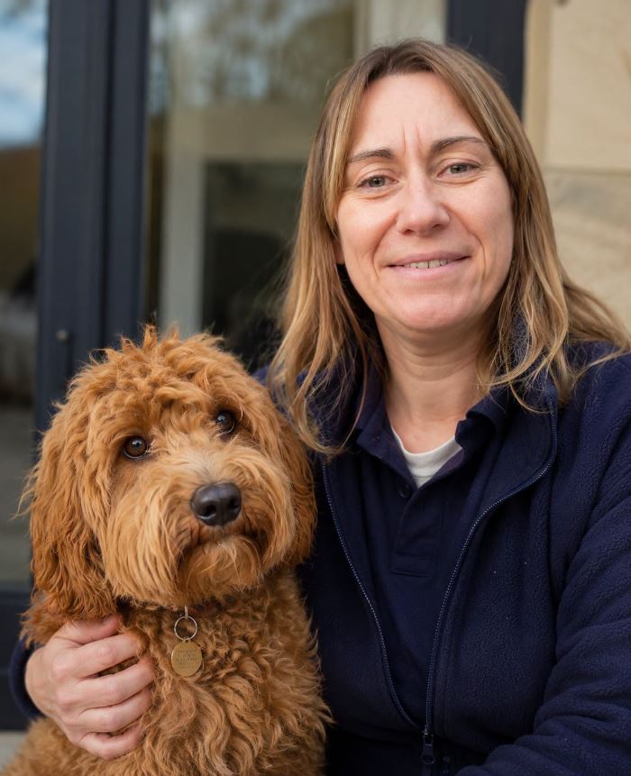 Pets 2 Places franchisee with a dog, representing the pet taxi franchise network